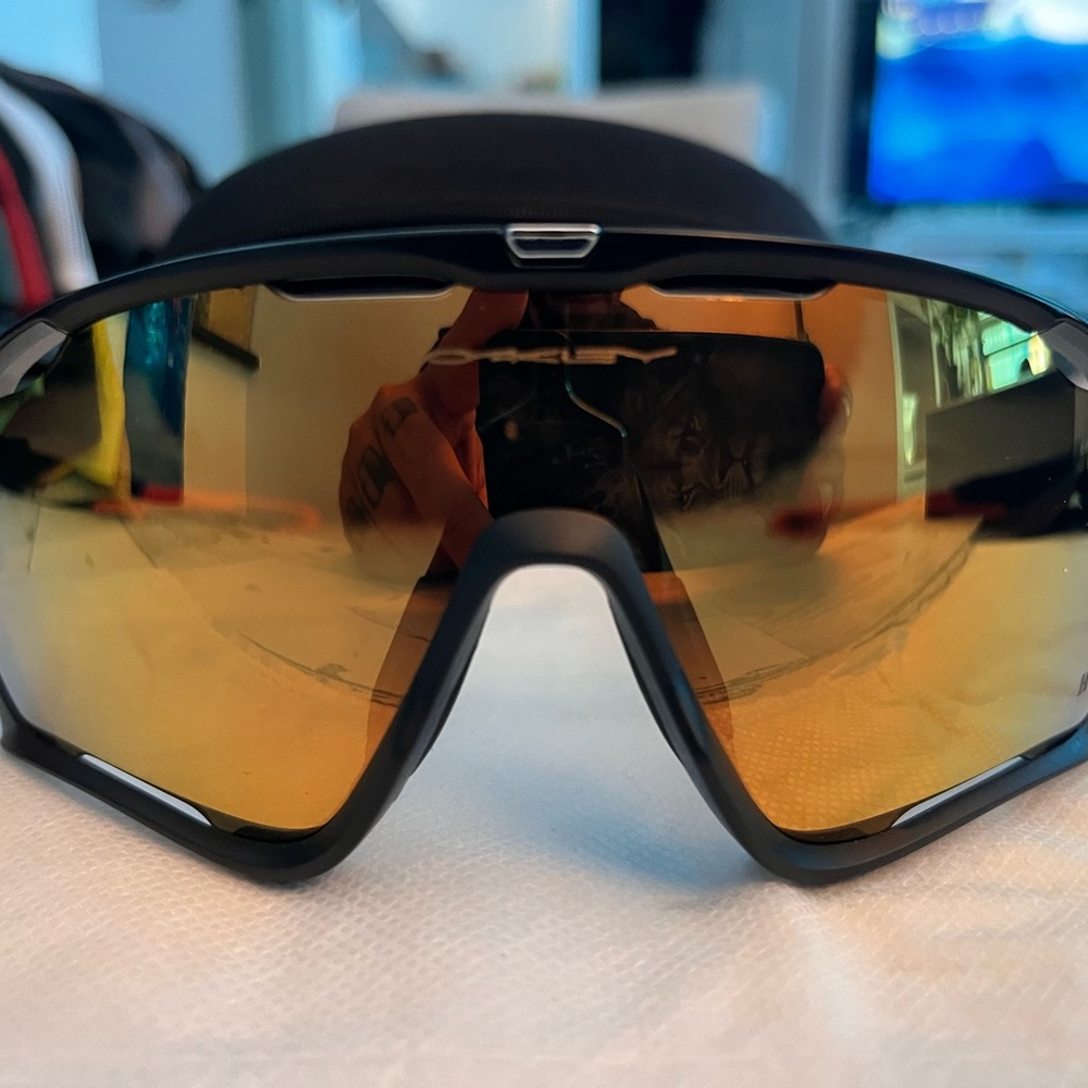 Oakley Sunglasses with Black Frame and Gold Lenses